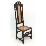 A 17thC Caroleon carved oak chair with crinolyn stretcher and later re-caning 52" high