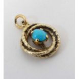 A silver gilt pendant set with central turquoise cabochon.