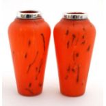 A pair of glass vases,