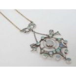 A silver gilt chain with silver pendant section set with white stones and opal like cabochons.