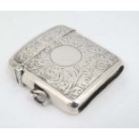 A silver large shaped vesta case with engraved acanthus scroll decoration.