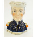 A Victorian Toby jug formed as a stylised Duke of Wellington having gilt detail. 7'' High.
