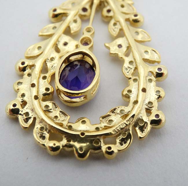 A silver gilt pendant set with amethysts and peridot. Marked 'Sterling' . - Image 3 of 4