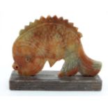 An Oriental soapstone 2-D image of a leaping carp fish 2 1/2" high x 3 1/4" wide