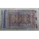 Rug / Carpet : a hand made woollen rug in buffs,