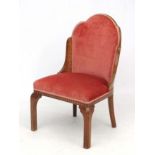Art Deco : A Walnut shaped and Cloud back upholstered chair with ornate inlay to seat banding and