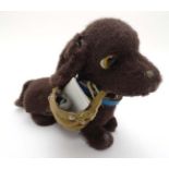 A vintage 1960s battery operated remote control '' Cheerful Dachshund '' puppy dog by Yonezawa,