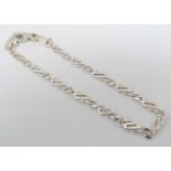 A silver bracelet of chain form marked '925 Italy' approx.