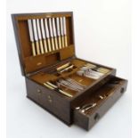 An oak cased part canteen of Mappin & Webb silver plate cutlery. With original receipt dated 1937.