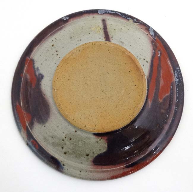 A large Studio pottery charger decorated to centre with the image of a rearing horse with - Image 2 of 4