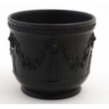 A early / mid 19thC Black Basalt '' Wedgwood '' pot decorated with lions masks with hanging swags