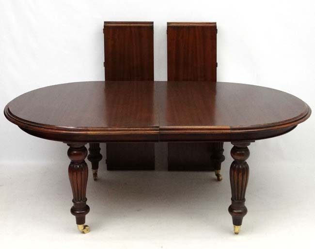 A late 20thC Victorian style mahogany D-ended wind out dining table, 80" long, - Image 2 of 3