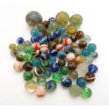 A collection of approximately 100 marbles including many hand blown examples, including cat's eye,