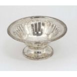 A silver pedestal bon bon dish with fret work decoration.