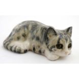 A J. Winstanley tabby cat with yellow glass eyes, size 7A, bears signature to base. 2 3/4'' high.