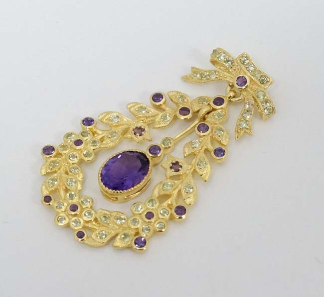 A silver gilt pendant set with amethysts and peridot. Marked 'Sterling' . - Image 4 of 4