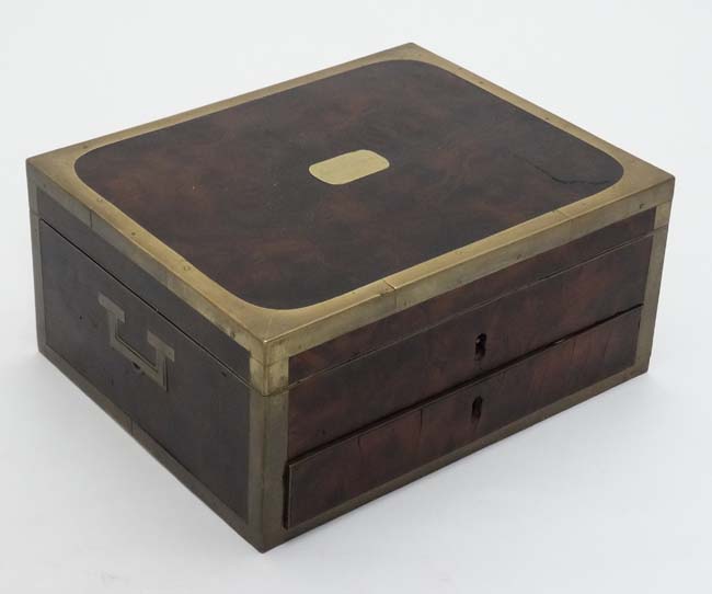 A burrwood Campaign box with brass edges and corners and drawer under.