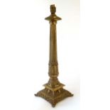 A 19thC style cast brass table lamp with squared base.