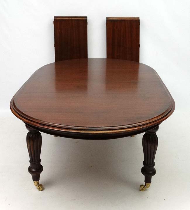 A late 20thC Victorian style mahogany D-ended wind out dining table, 80" long, - Image 3 of 3