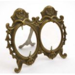 A 20thC cast brass photograph easel / strut frame with double oval apertures 6 1/4" high x 7 1/8"