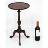 A 20thC mahogany tripod wine table 21" high x 11 3/4" diameter CONDITION: Please