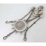 A silver plate chatelaine with naval / nautical decoration depicting anchor,