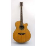 Musical Instruments : A late 20thC six string Electro - Acoustic Guitar by Godman ( model F561EQ/N