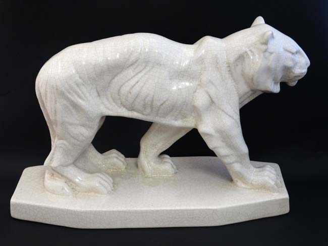 An Art Deco style Emaux De Louviere style white crackle glaze figure of a tiger,