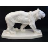 An Art Deco style Emaux De Louviere style white crackle glaze figure of a tiger,