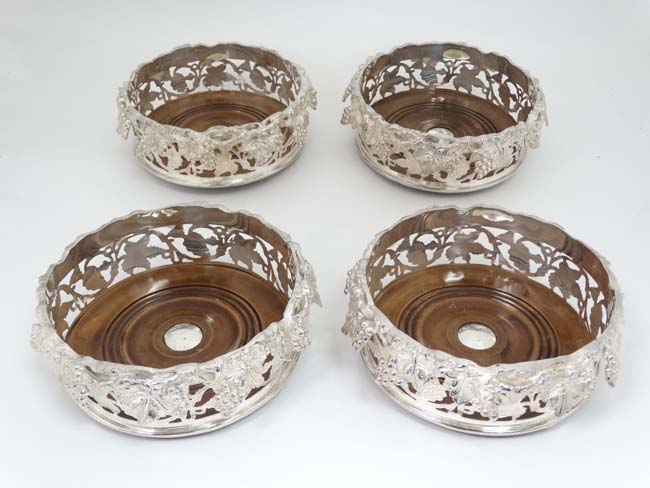 A set of 4 21stC magnum bottle coasters / decanter stands with silver plate galleried sides with