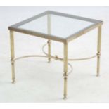 Mid Century / Hollywood Regency : Manner of Maison Jansen a glass topped four legged gilt bronze