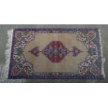 Rug / Carpet : a hand made woollen rug with mild mustard ground around a hexagonal central