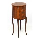 Mid Century / Hollywood Regency : A circular walnut ( inlaid and cross veneered) four legged three