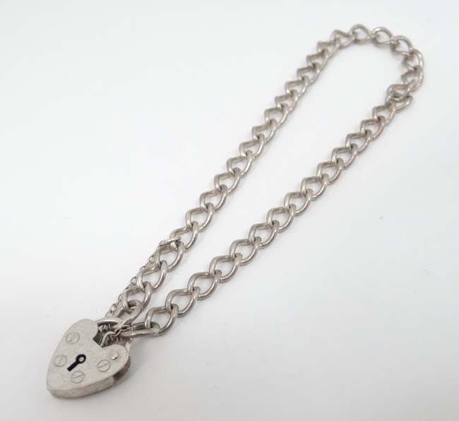 A silver bracelet with padlock clasp hallmarked London 1984 maker ASJ. - Image 3 of 4