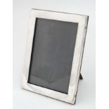 A silver photograph frame hallmarked Birmingham 1918 maker William Neale Ltd .