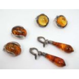 3 pair of assorted amber silver and white metal earrings (3) CONDITION: Please Note