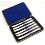 A cased set of 6 silver handled butter knives bearing hallmarks for Sheffield 1911 maker Isaac