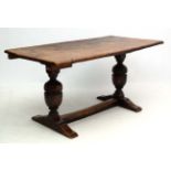 A 17thC oak trestle table with cup and cover columns and 2 piece top 31" wide x 59" long