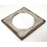 A photograph frame with silver surround, Hallmarked Birmingham 1904 maker Henry Charles Freeman.