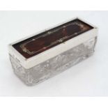 A cut glass dressing table box with silver and tortoiseshell top hallmarked London 1929 maker