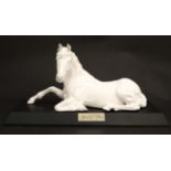 A Royal Doulton model formed as a recumbent horse '' Spirit of Peace '',