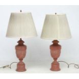 Leviton USA : A pair of painted wood and brass urn shaped table lamps,