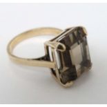 A 9ct gold ring set with smoky quartz CONDITION: Please Note - we do not make