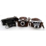 Four cased 20thC vintage 35mm cameras , comprising a Zeiss Ikon ' Contaflex ' SLR ,