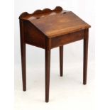 A 19thC mahogany clerks desk opening to reveal compartments within 27 1/4" wide x 19" deep x 37"