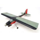 Remote control Aeroplane : a single engine single wing aeroplane known as ' For What ' in red,