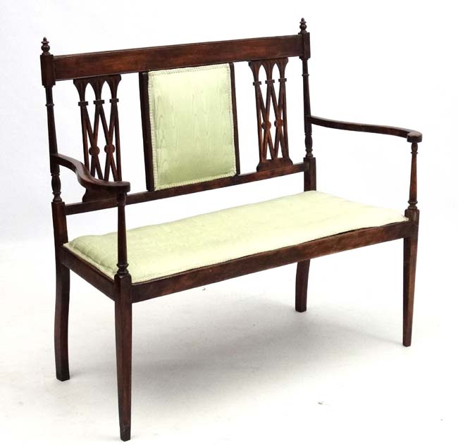 An Edwardian open arm 2-seat sofa 44 3/4" wide 39 3/4" high CONDITION: Please Note