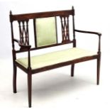 An Edwardian open arm 2-seat sofa 44 3/4" wide 39 3/4" high CONDITION: Please Note