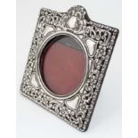 An Art Nouveau silver mounted photograph frame with heart,