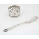A silver napkin ring hallmarked London 1907 together with a silver butter knife hallmarked